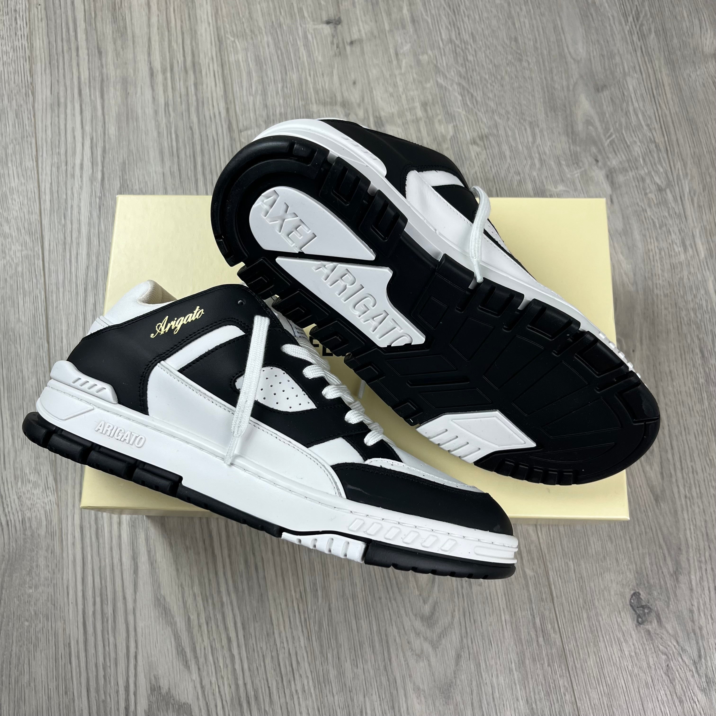 Men's Axel Arigato Arena Lo Sneakers in White/Black. On sale at Open Attire.