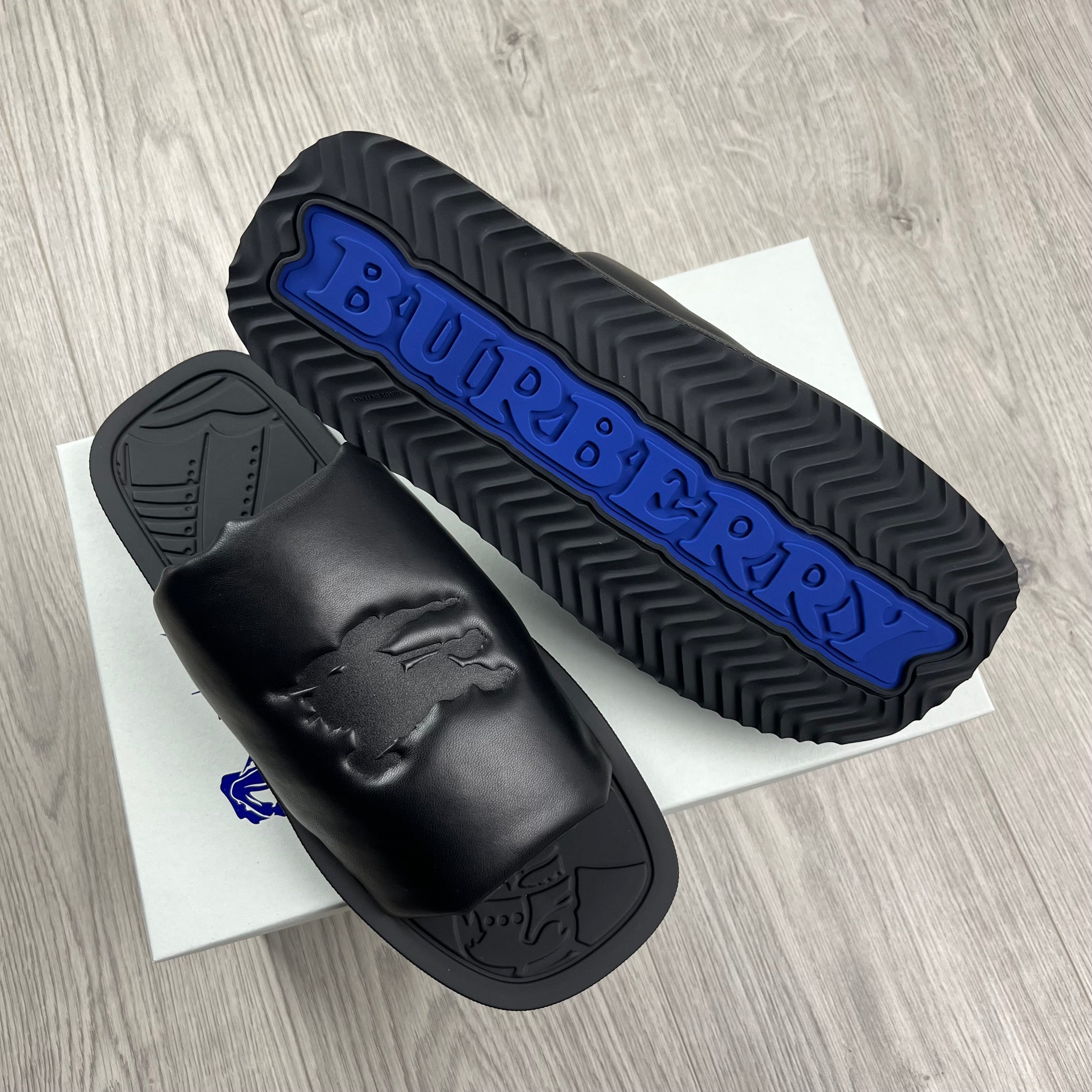 Burberry EKD Slab Slides in Black. On sale at Open Attire.