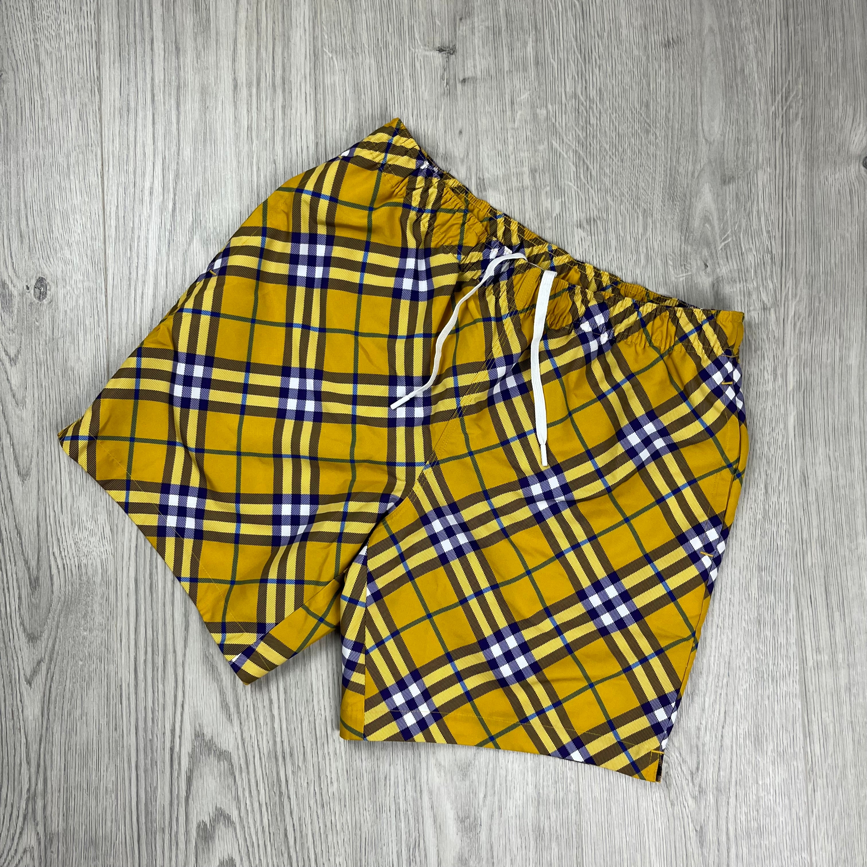 Burberry Vintage Check Swim Shorts in Yellow Pear. On sale at Open Attire.