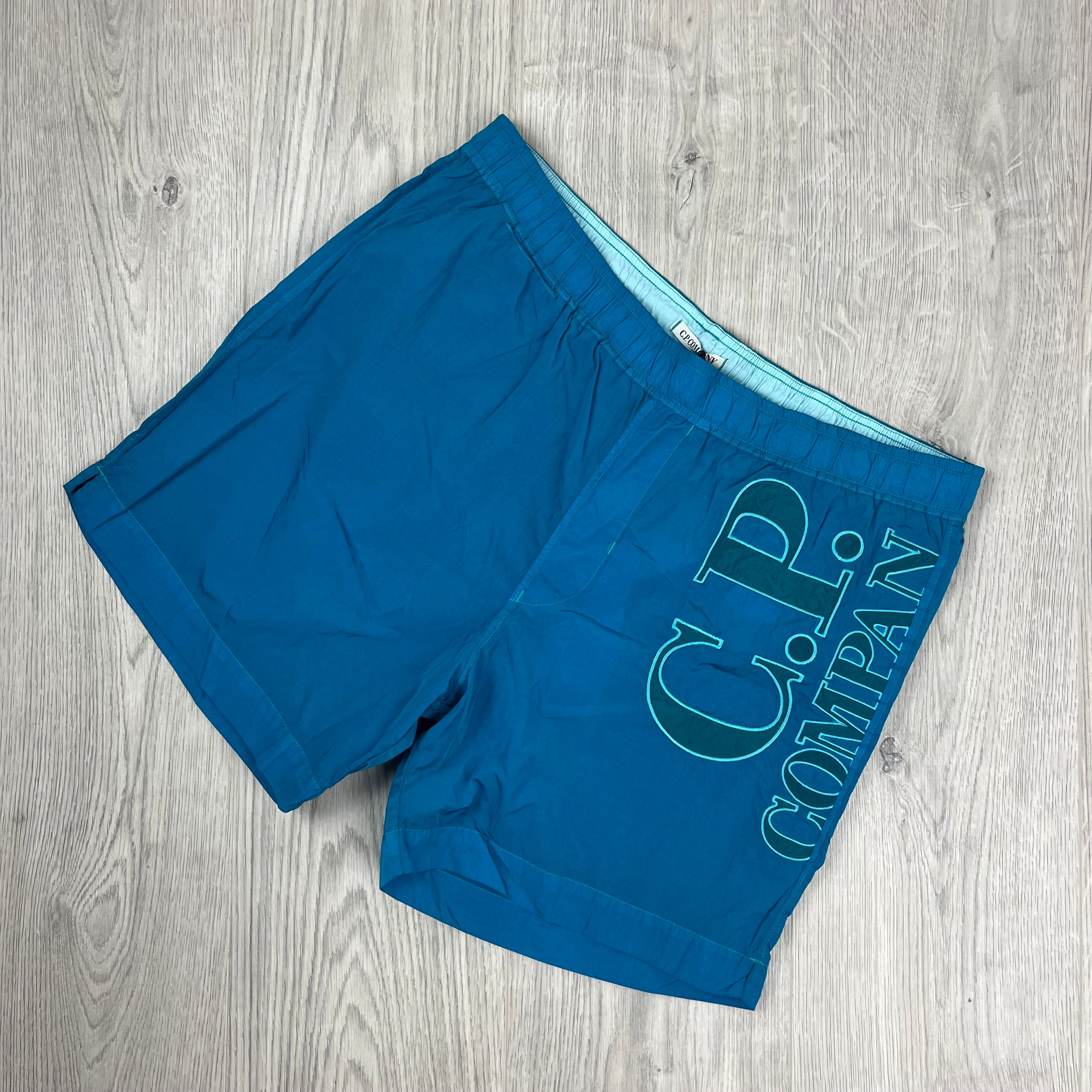 CP Company Chrome-R Swim Shorts in Tile Blue. On sale at Open Attire.