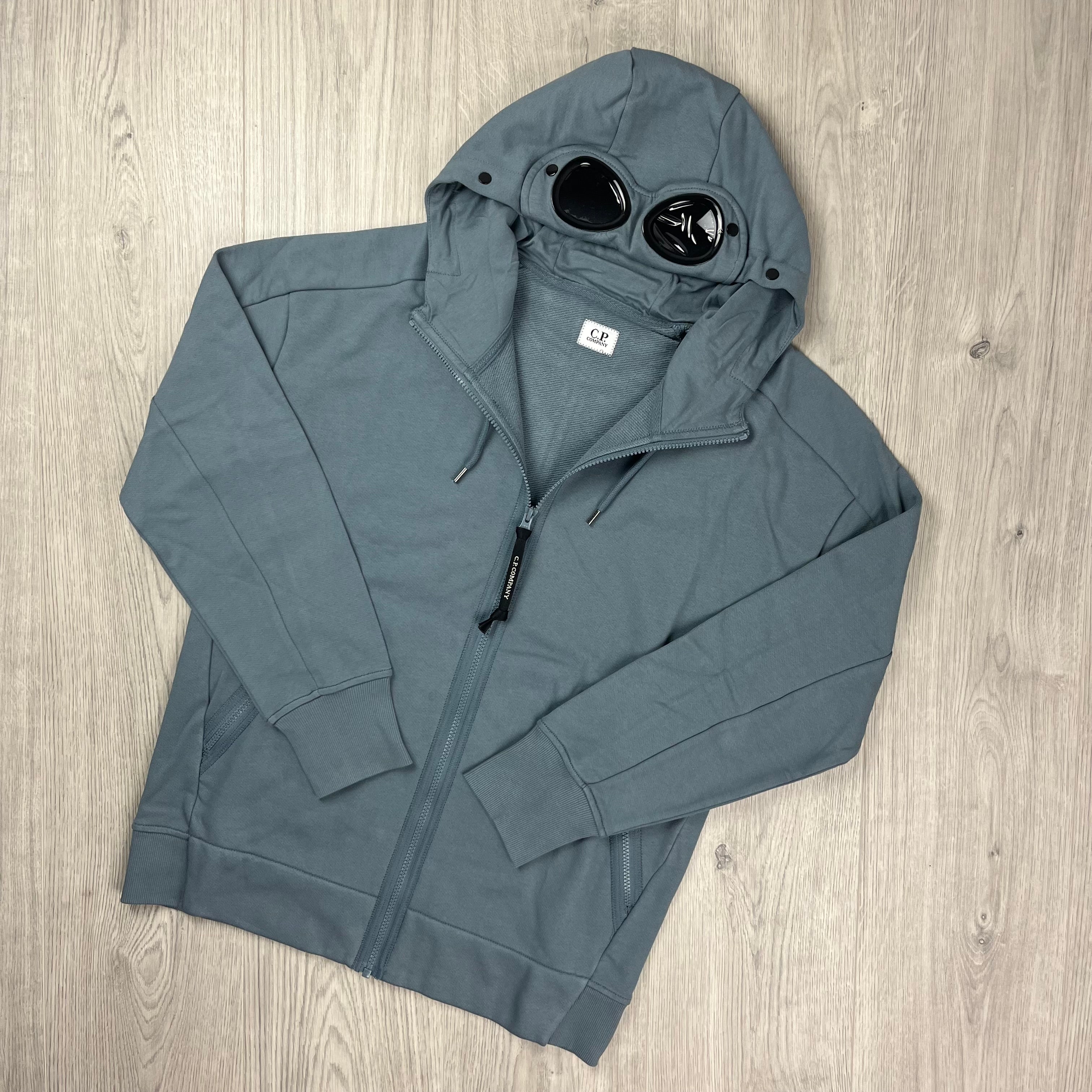 CP Company Diagonal Raised Fleece Goggle Hoodie in Stormy Weather. On sale at Open Attire.