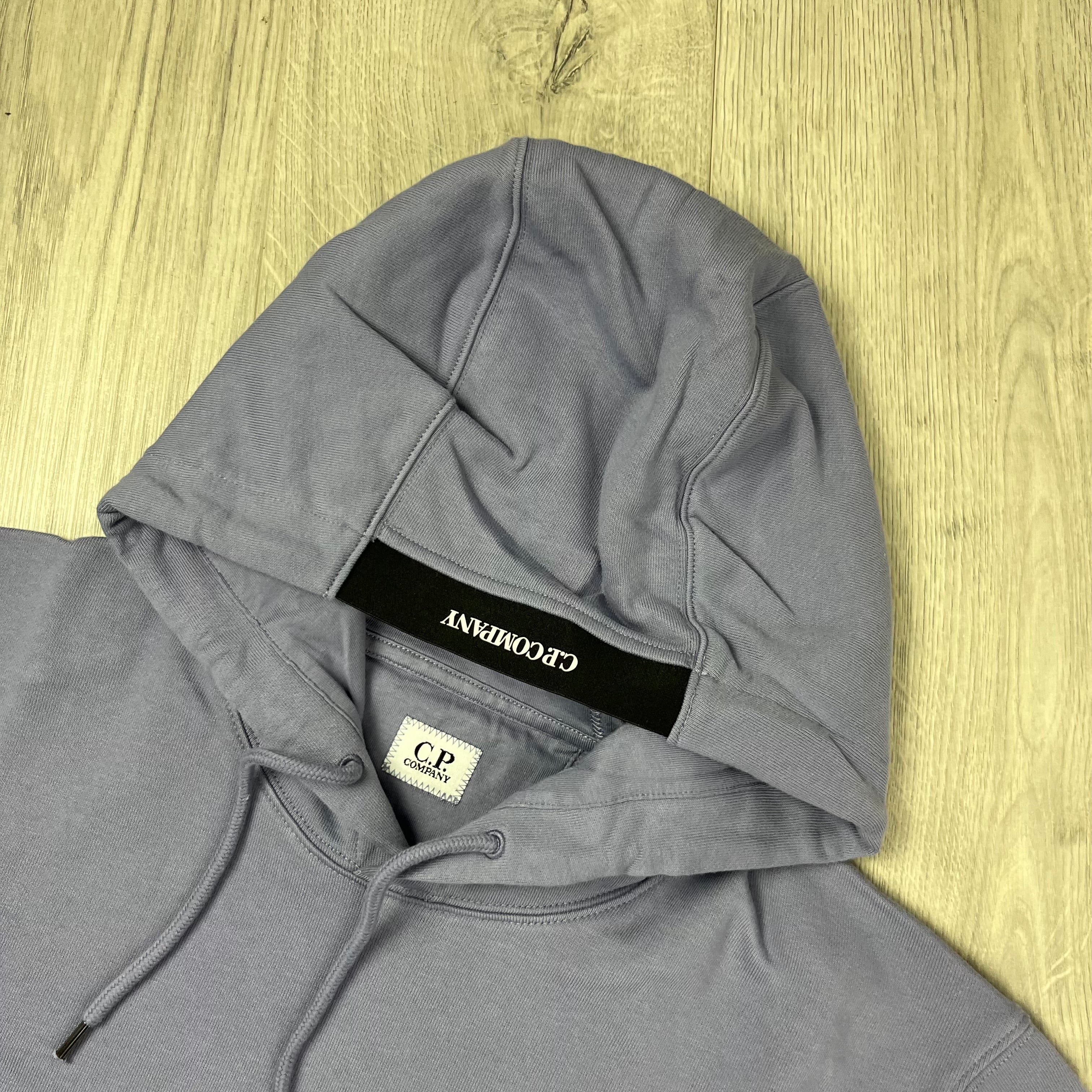 CP Company Diagonal Raised Fleece Hoodie in Lavender Violet. On sale at Open Attire.