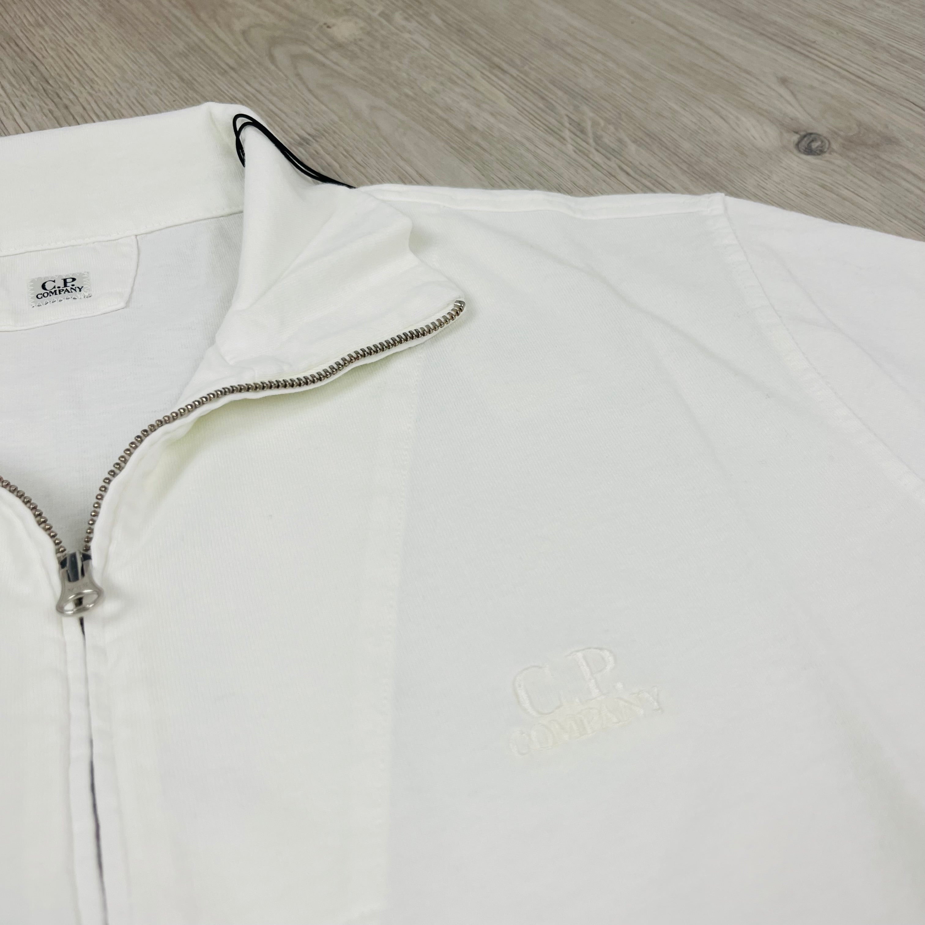 CP Company 1020 Zip Polo Shirt in Gauze White. On sale at Open Attire.