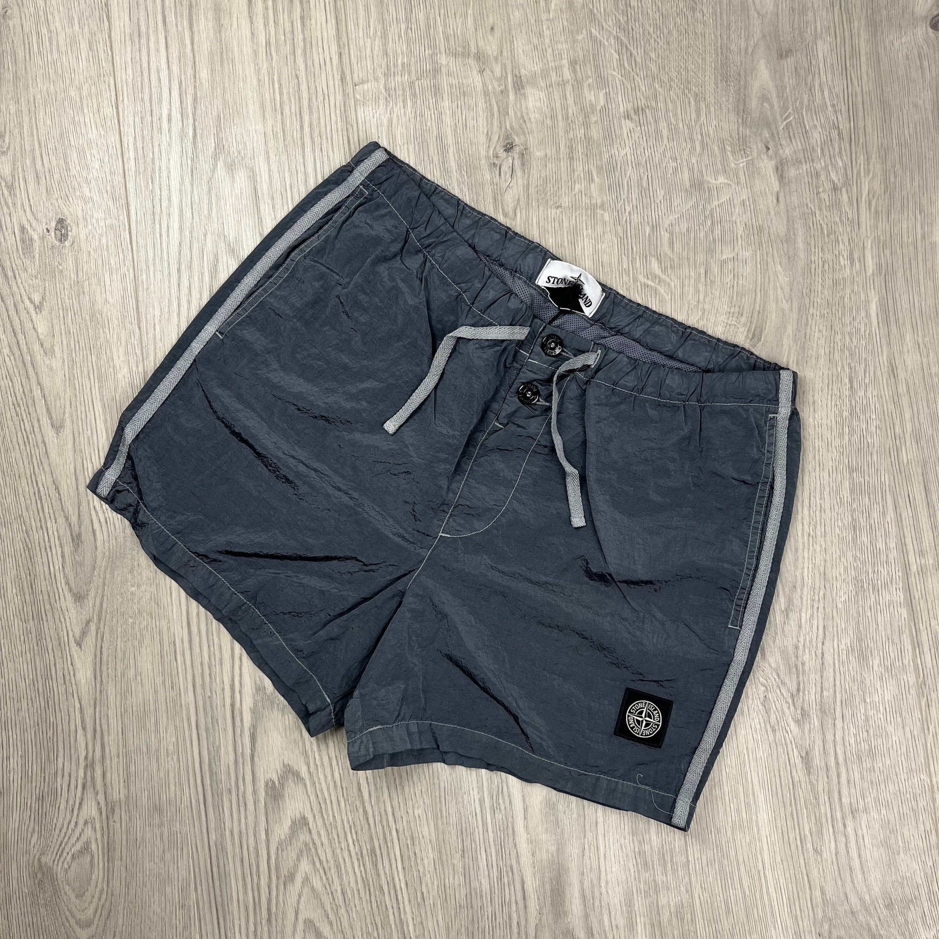 Stone Island Nylon Metal Swim Shorts in Avio Blue. On sale at Open Attire.