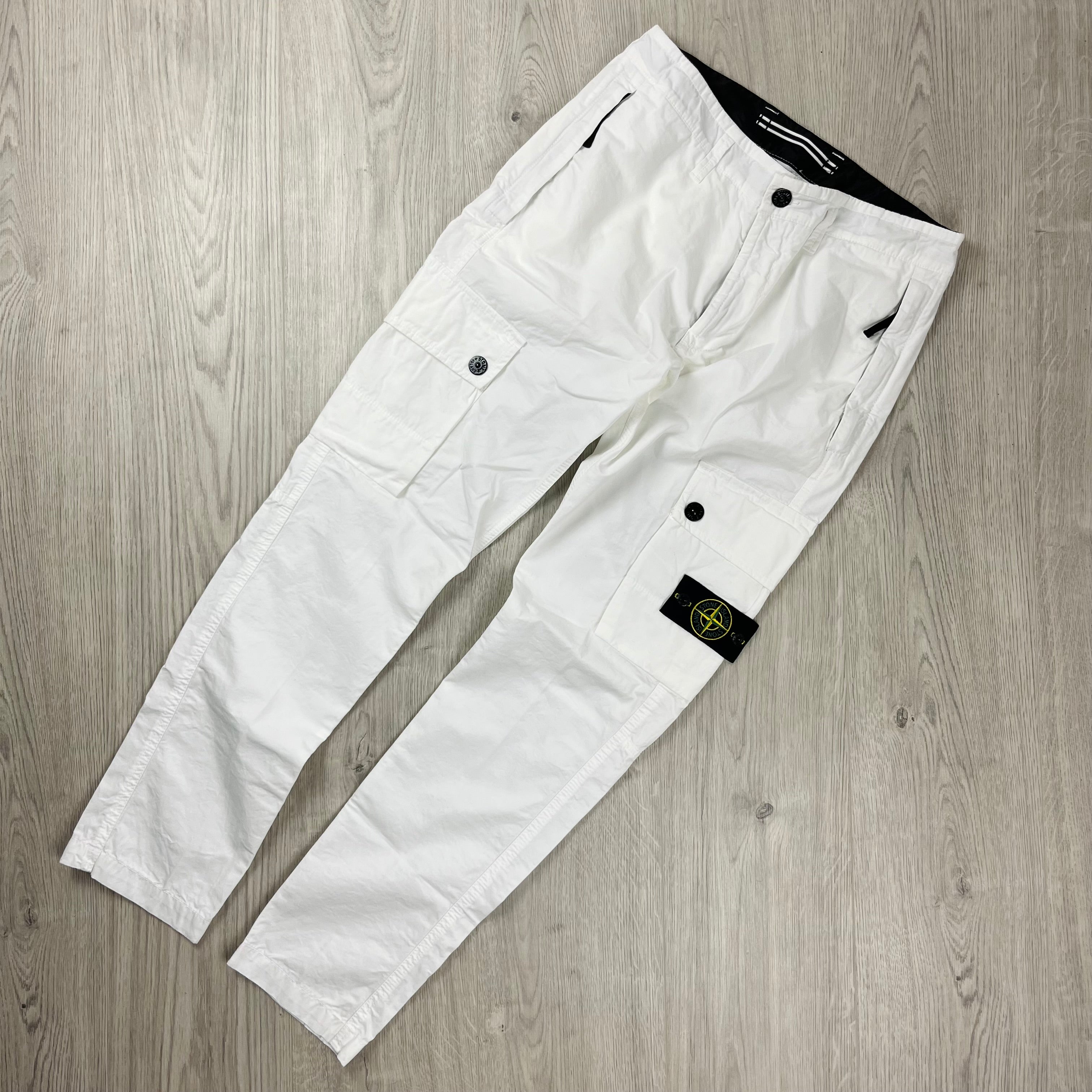 Stone Island 'OLD' treatment cargo trousers in White. On sale at Open Attire.