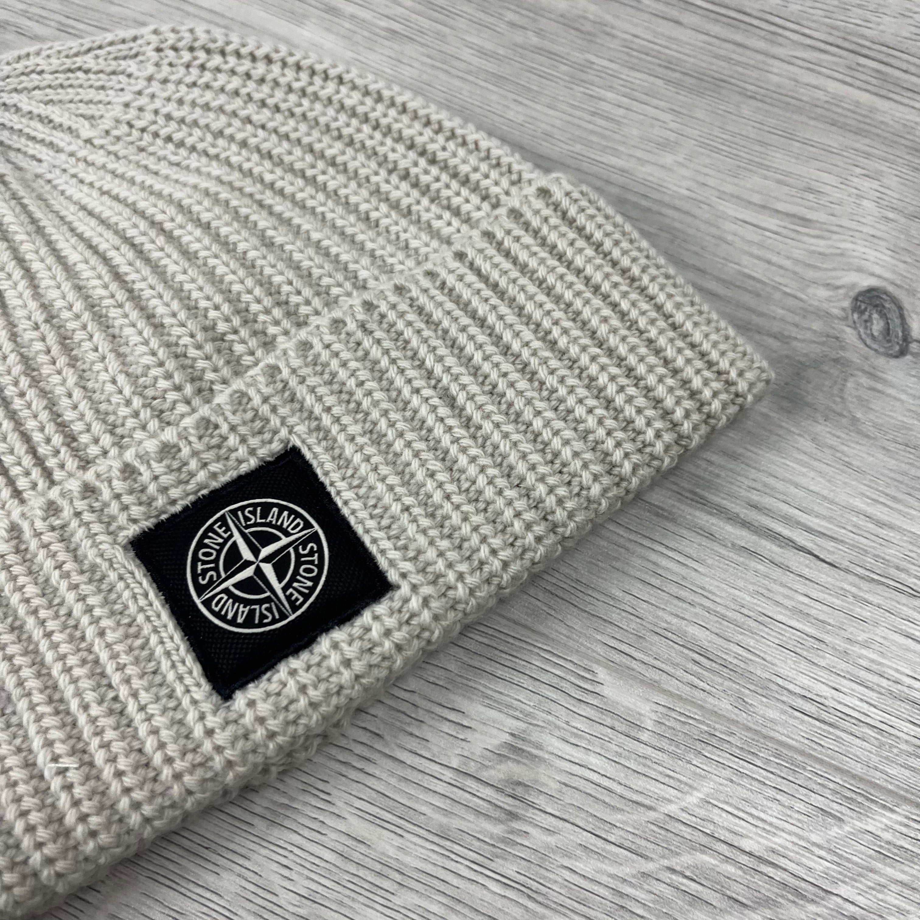 Stone Island wool beanie in Plaster. On sale at Open Attire.