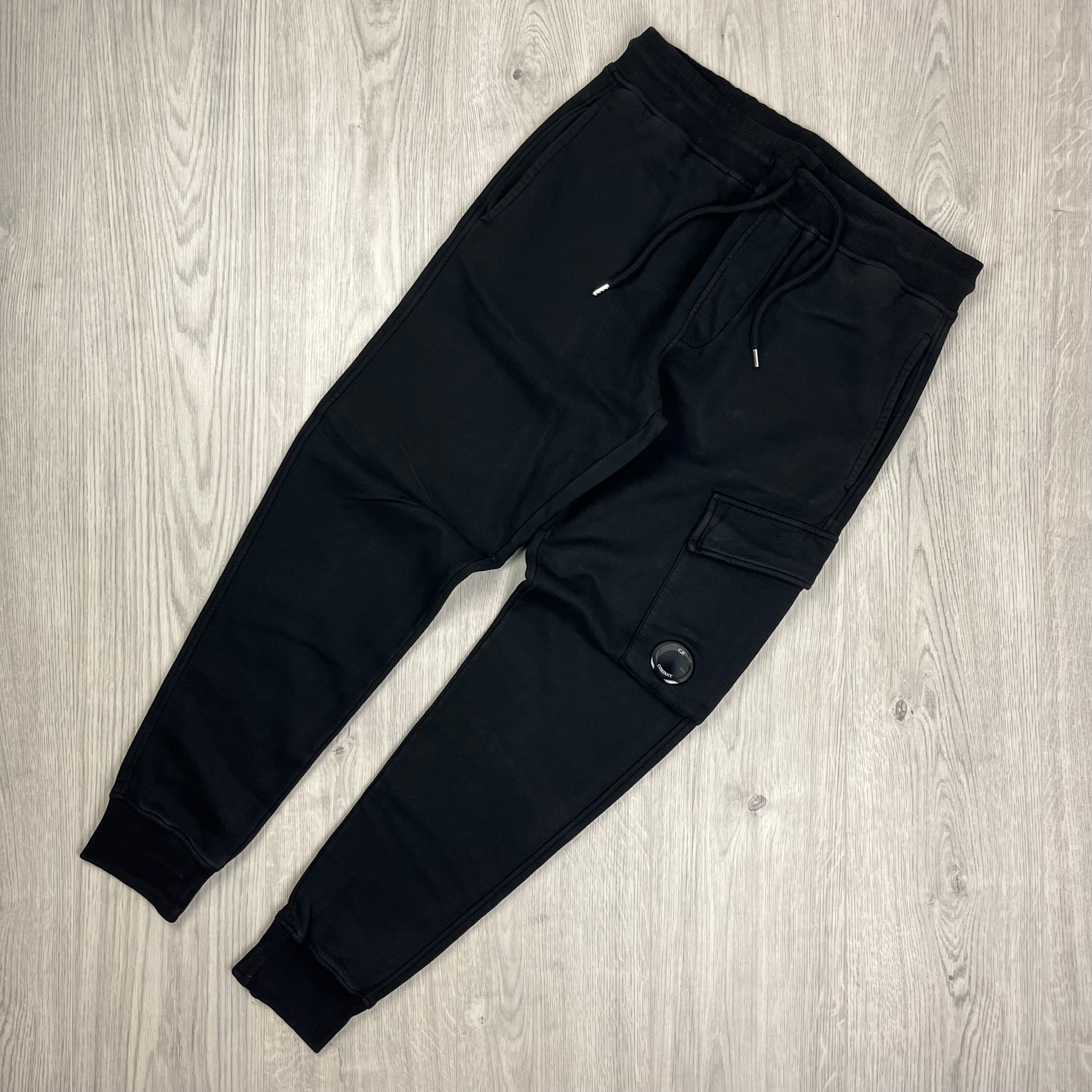 CP Company Black Tracksuit consisting of a hoodie and sweatpants. On sale at Open Attire.