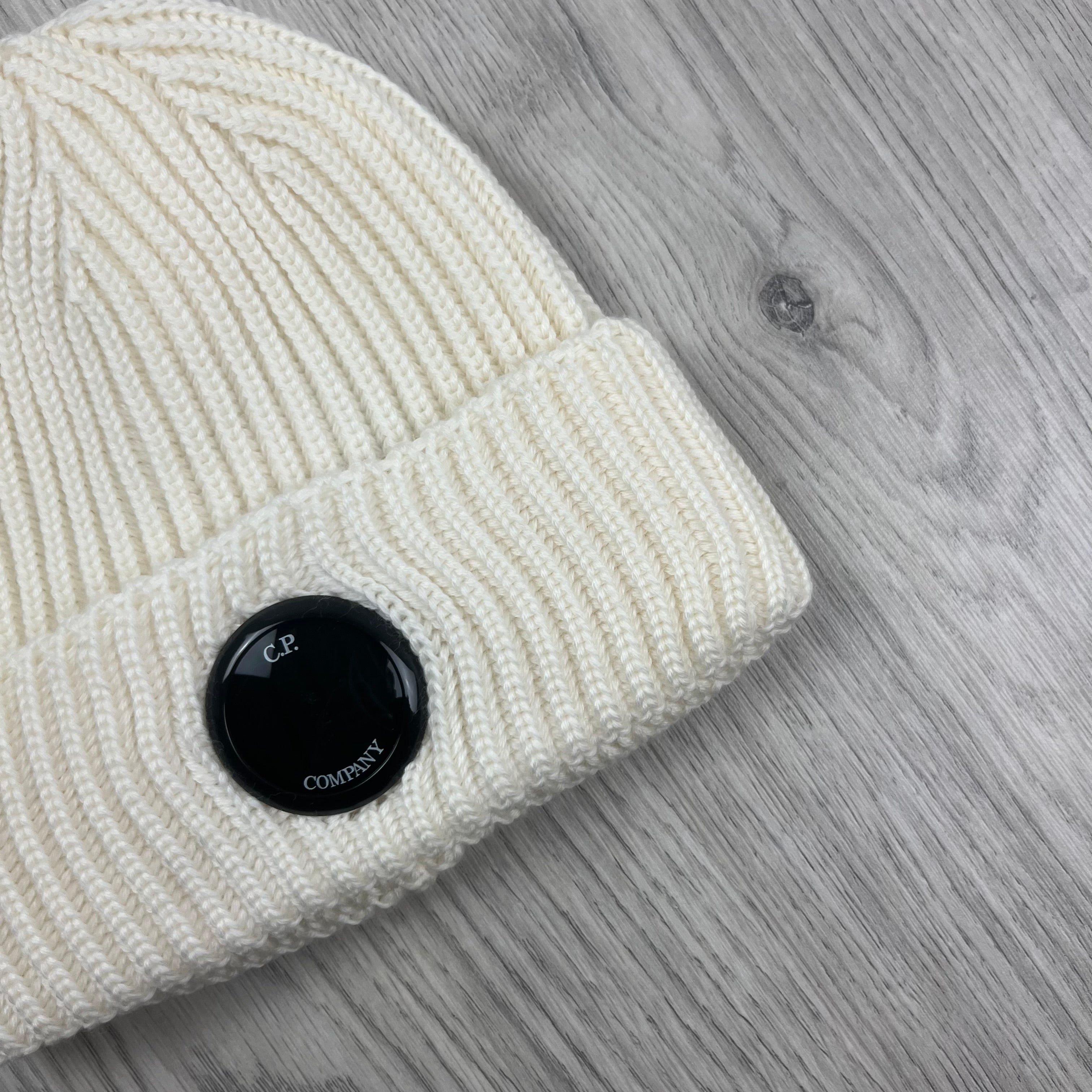 CP Company Merino Wool Lens Beanie in Gauze White. On sale at Open Attire.