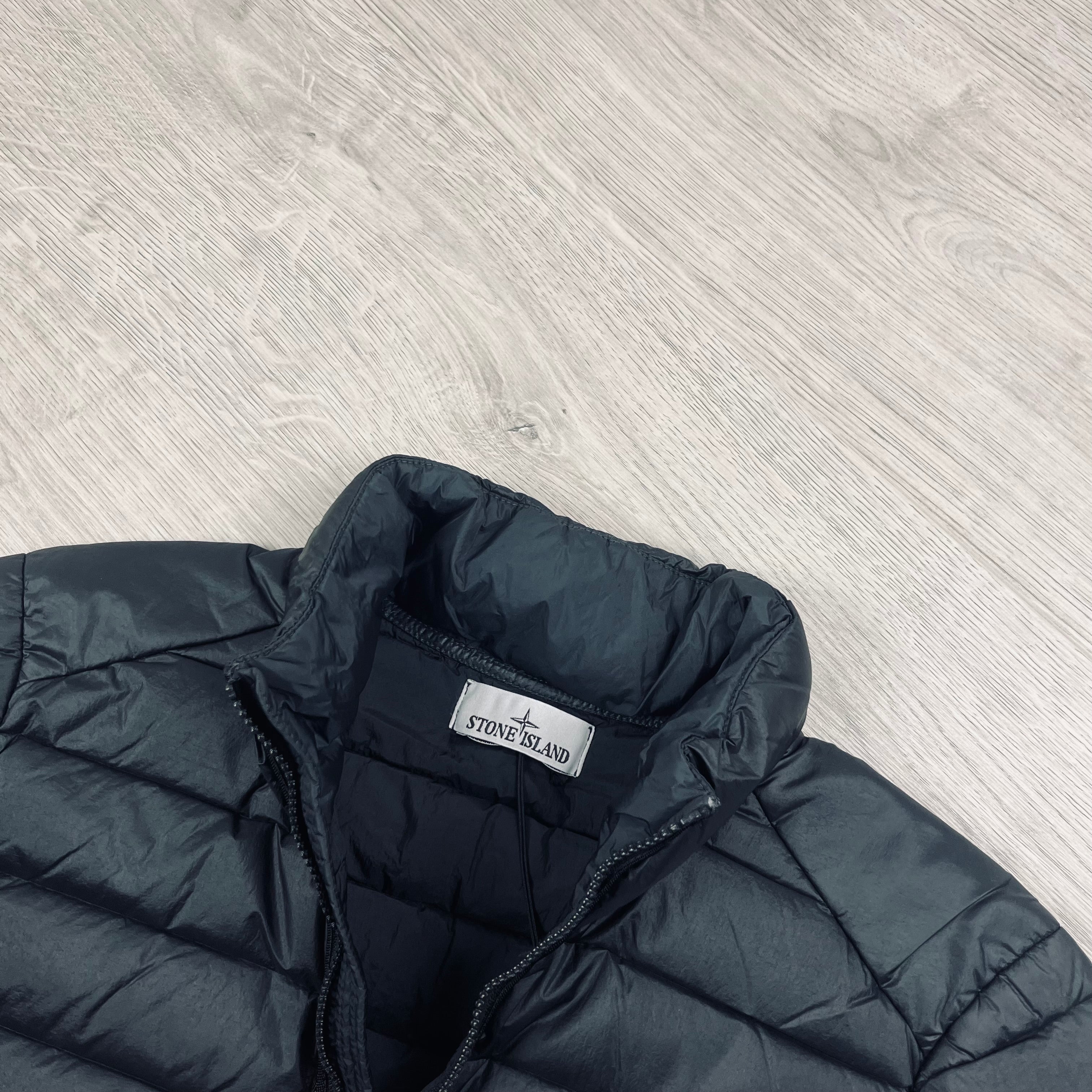 Stone Island Loom Woven Down Jacket in Black. On sale at Open Attire.