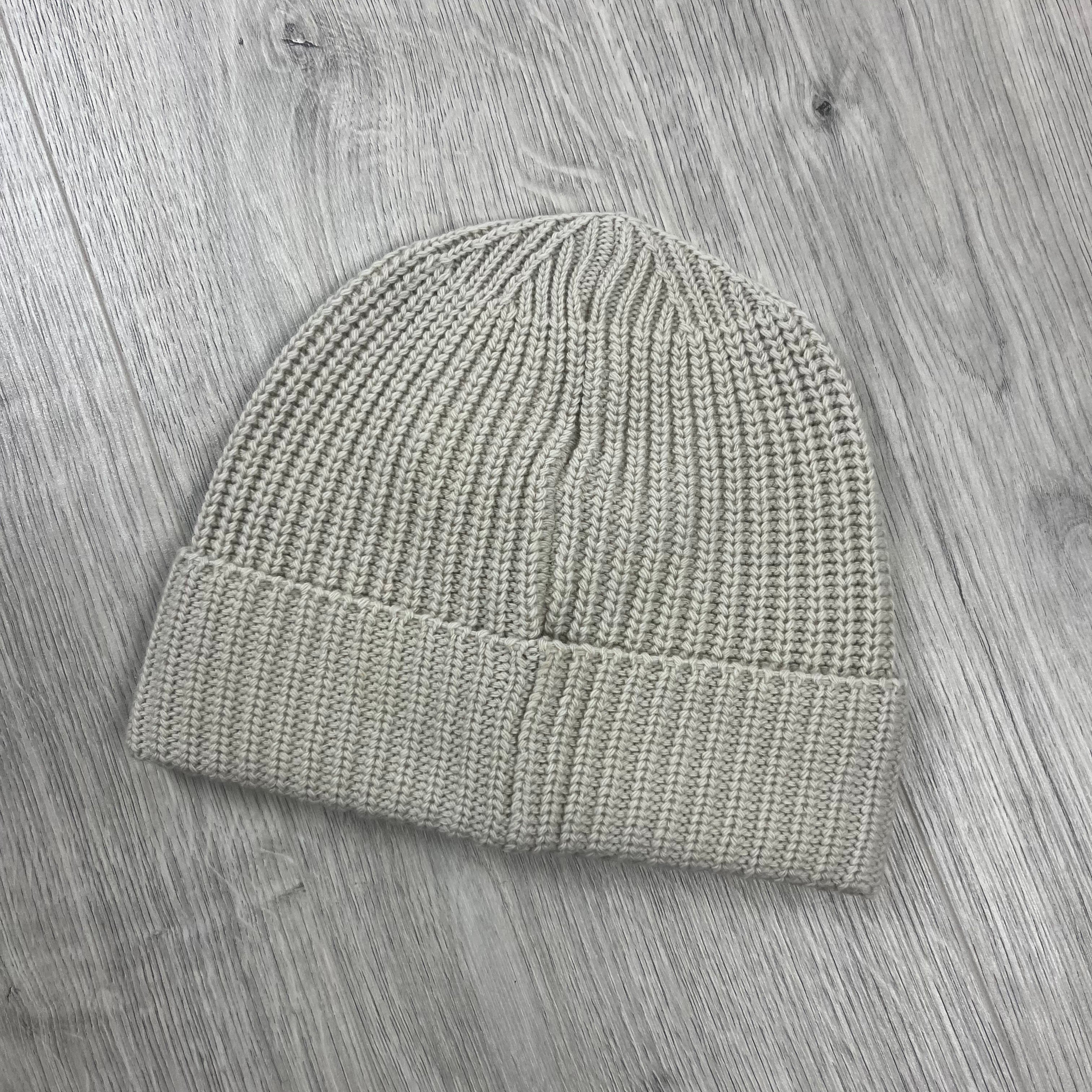 Stone Island wool beanie in Plaster. On sale at Open Attire.