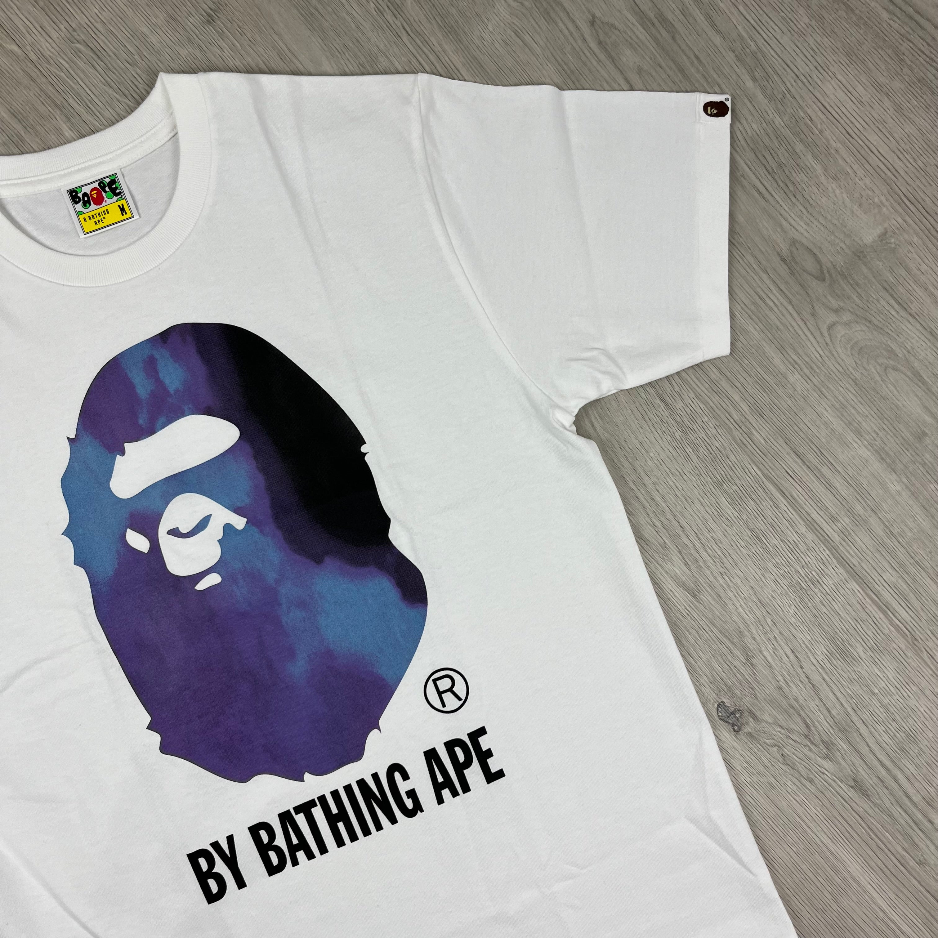 A Bathing Ape 'Ape Head' Tie Dye T-Shirt in White. On sale at Open Attire. 