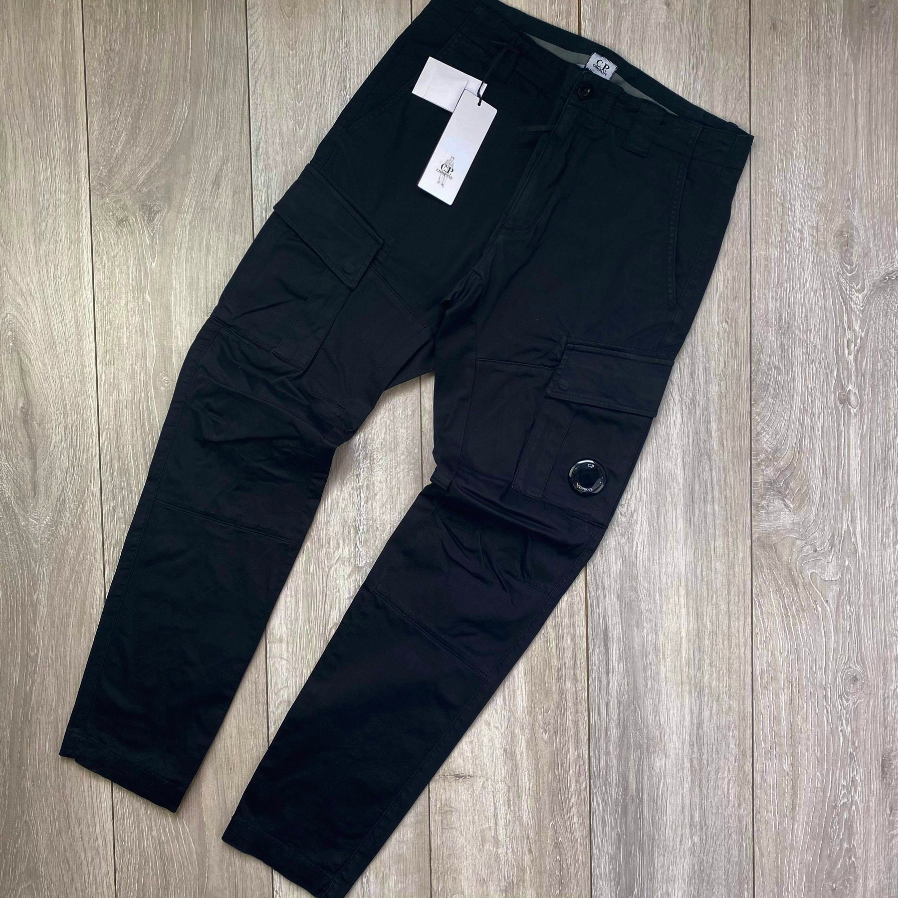 CP Company Stretch Sateen Cargo Trousers in Black. On sale at Open Attire.