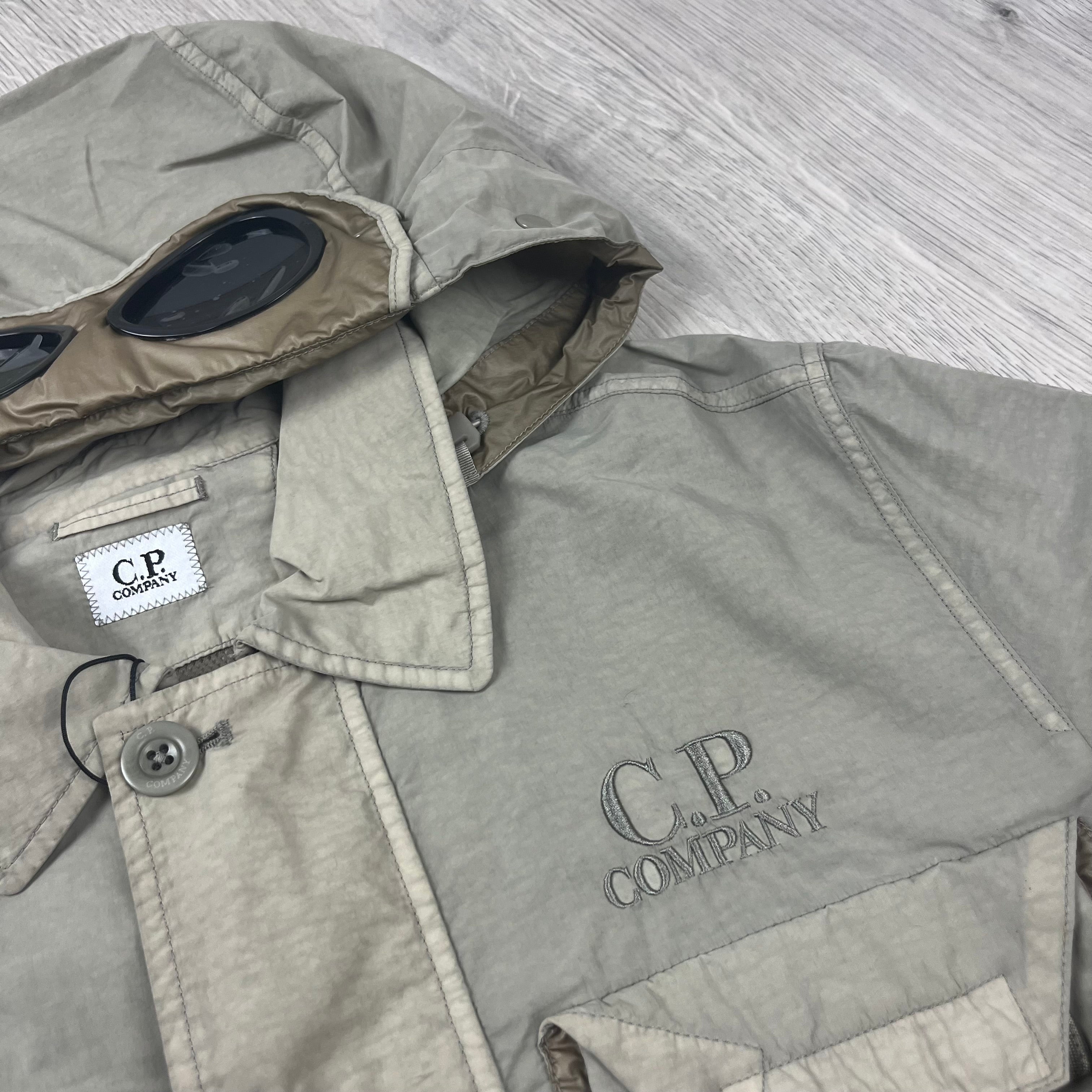 CP Company Flatt Nylon Hooded Overshirt in Vintage Khaki. On sale at Open Attire.