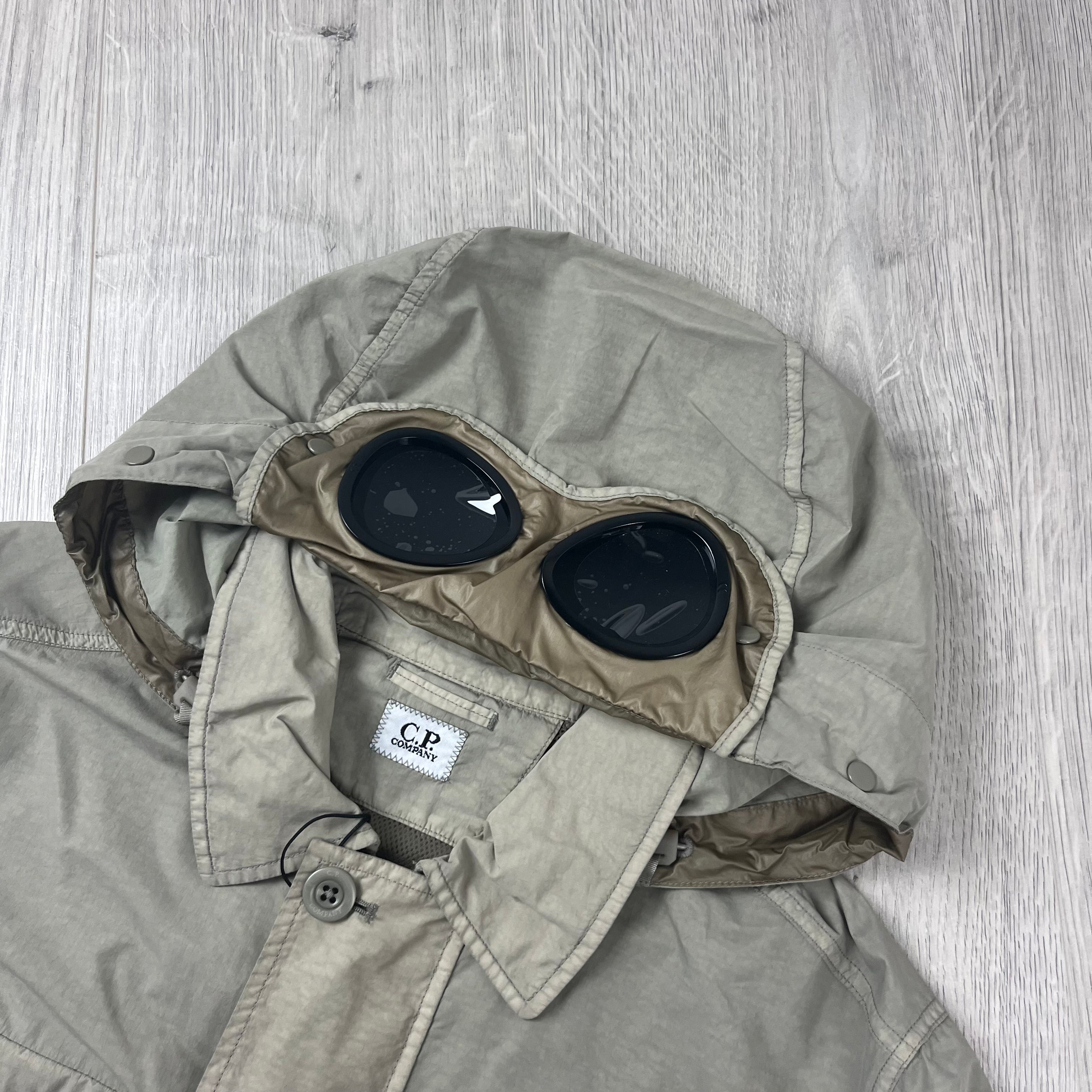CP Company Flatt Nylon Hooded Overshirt in Vintage Khaki. On sale at Open Attire.