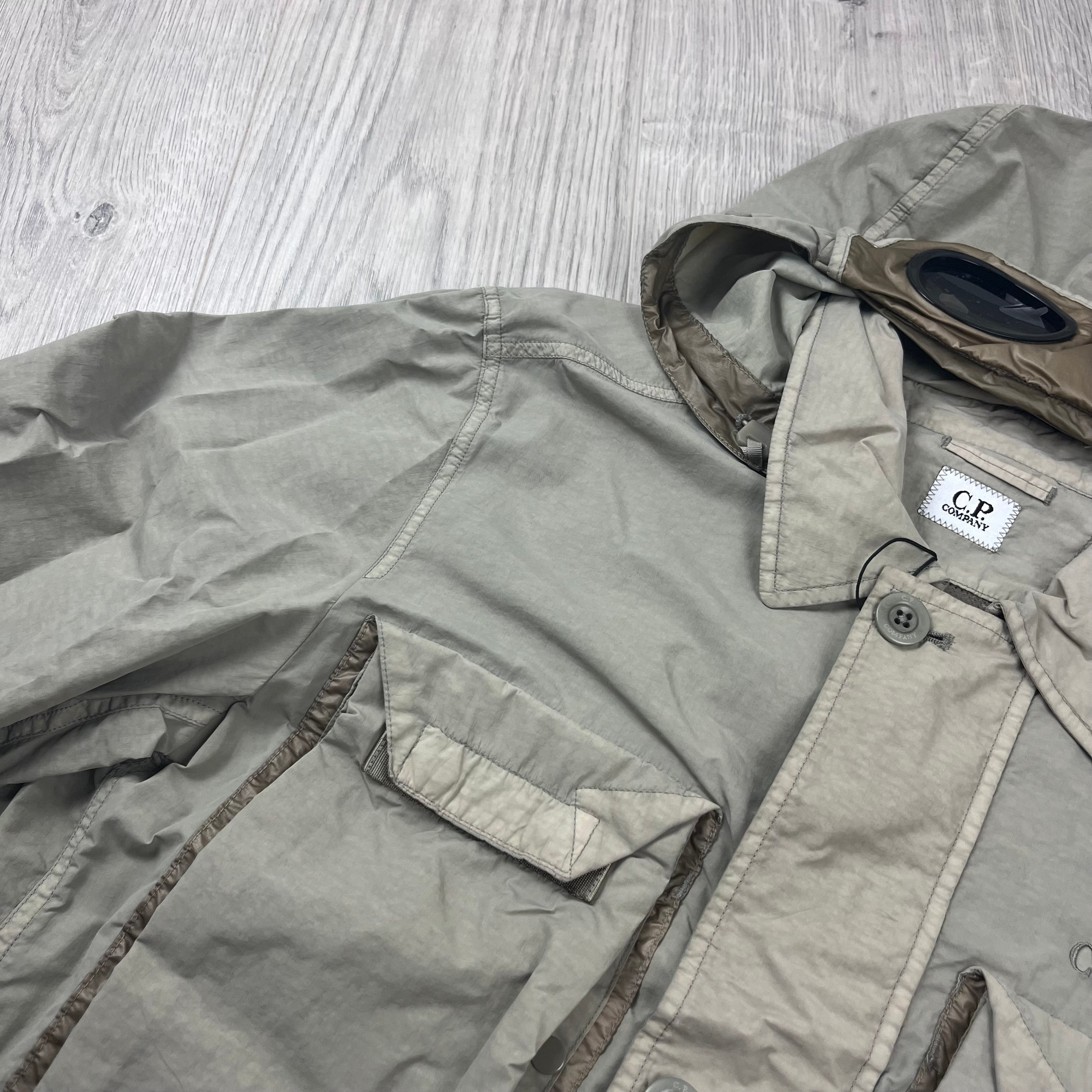 CP Company Flatt Nylon Hooded Overshirt in Vintage Khaki. On sale at Open Attire.