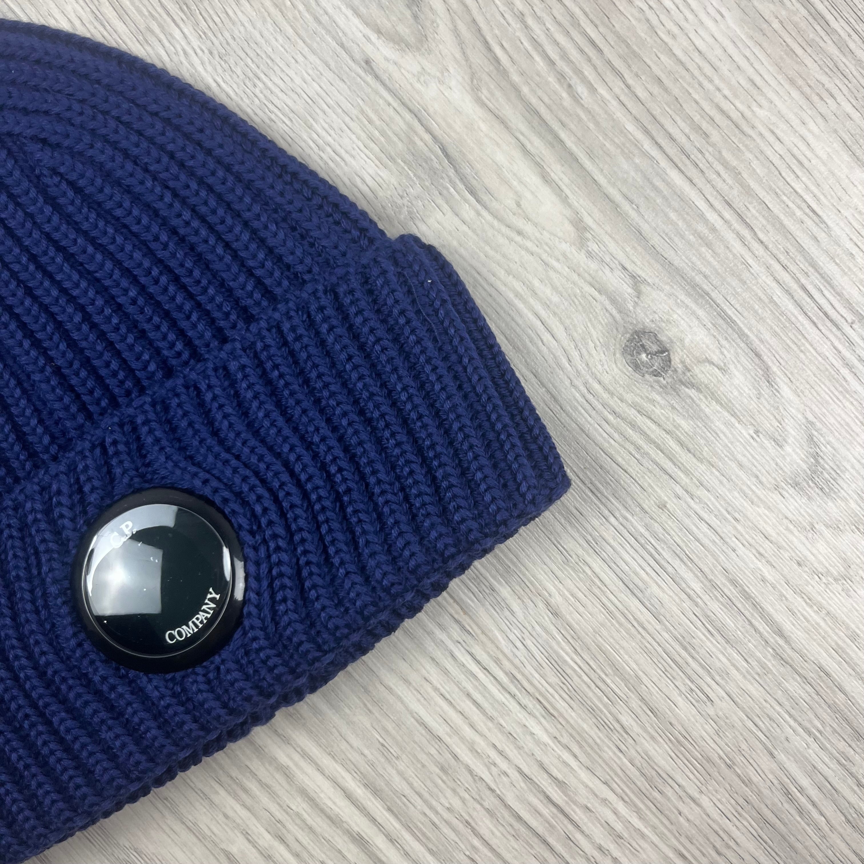 CP Company Merino Wool Lens Beanie in Estate Blue. On sale at Open Attire.