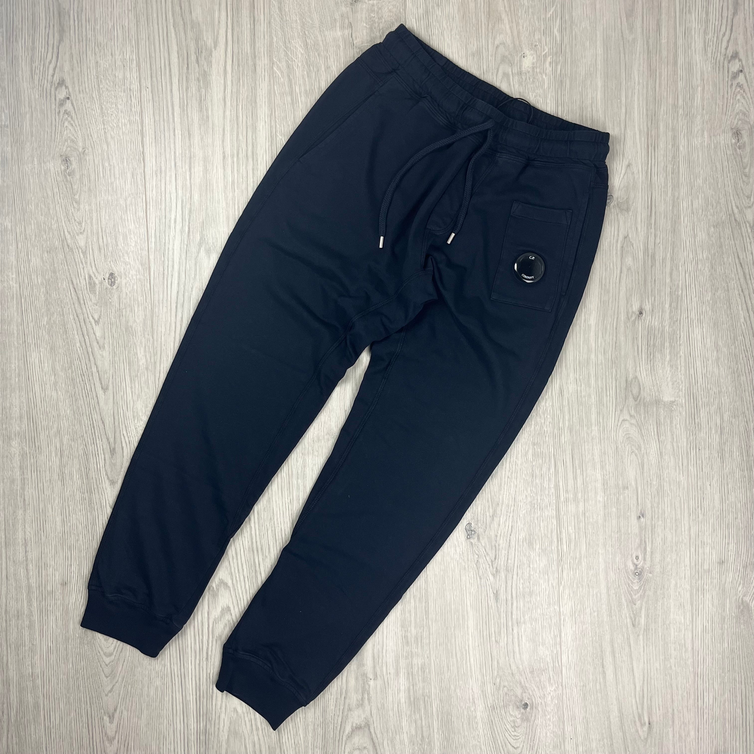 CP Company Utility Sweatpants in Total Eclipse Navy Blue. On sale at Open Attire.