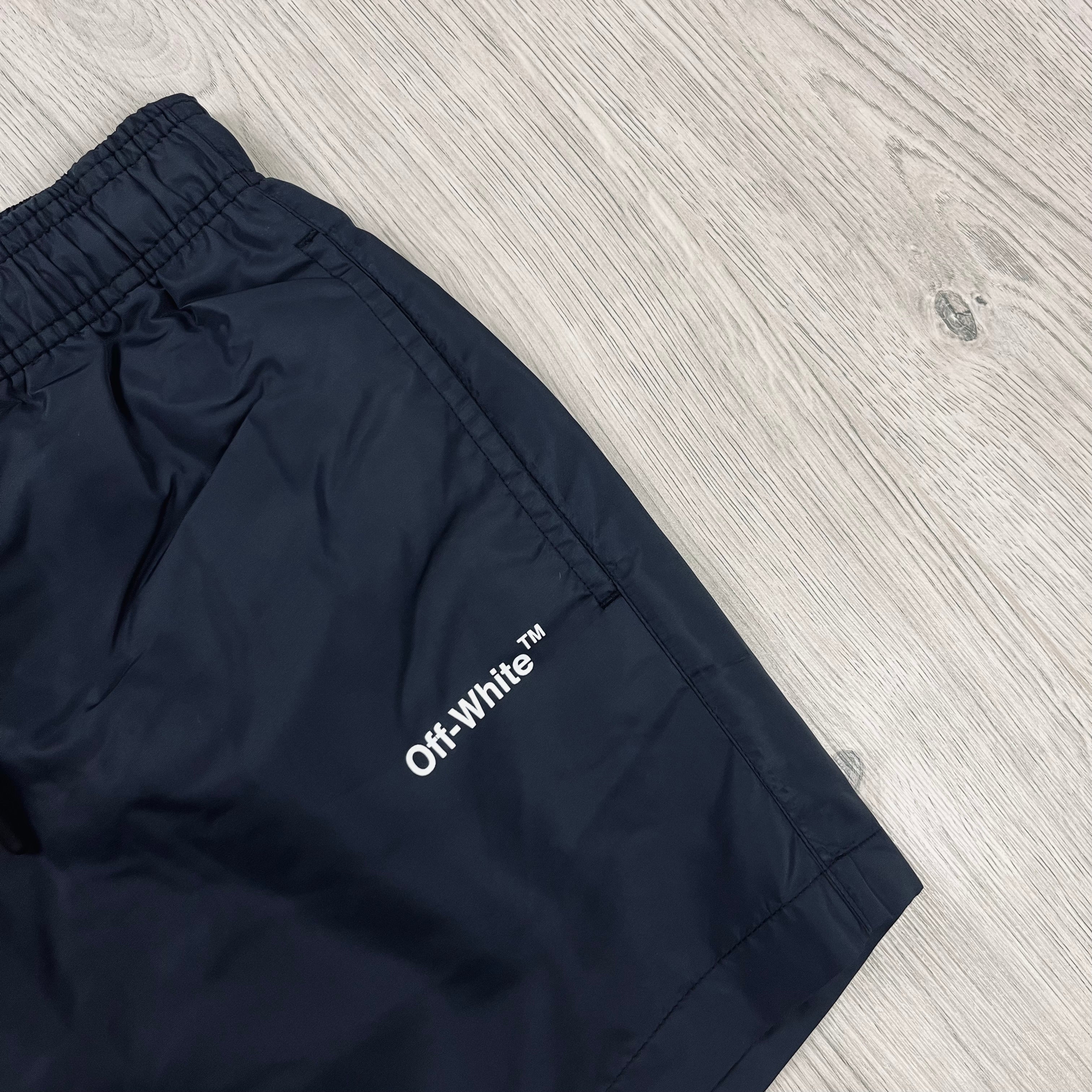 Off-White c/o Virgil Abloh Arrow Swim Shorts in Black. On sale at Open Attire.
