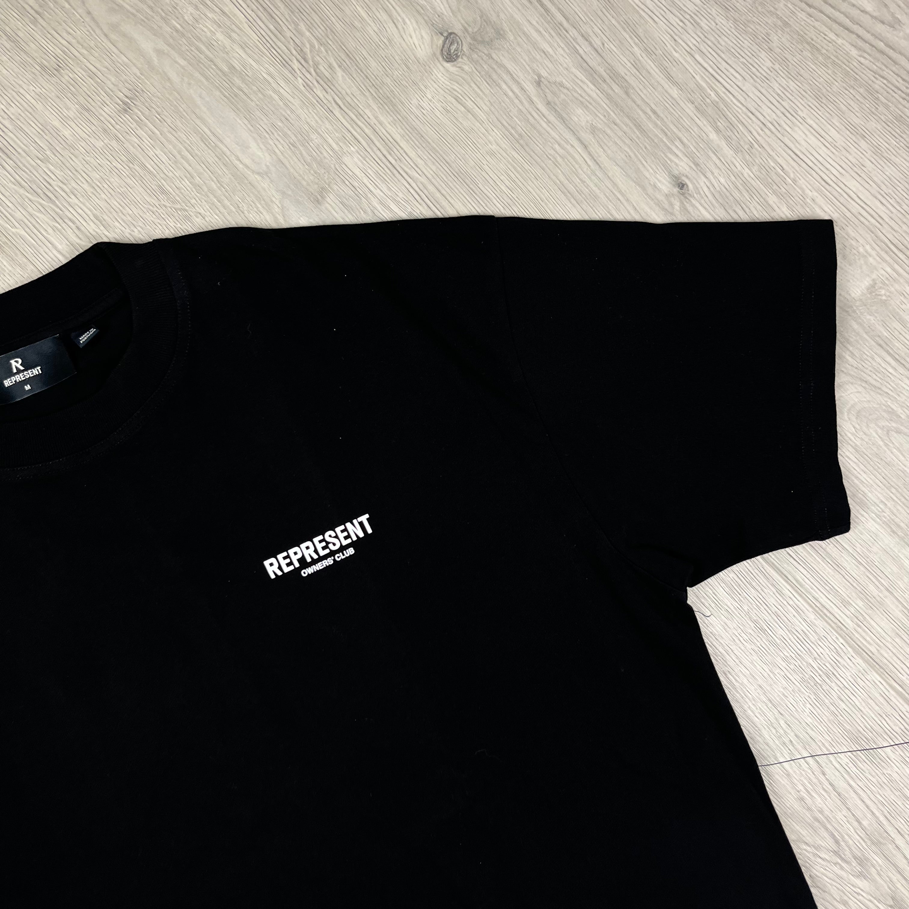 Represent 'Owners Club' T-shirt in Black. On sale at Open Attire.