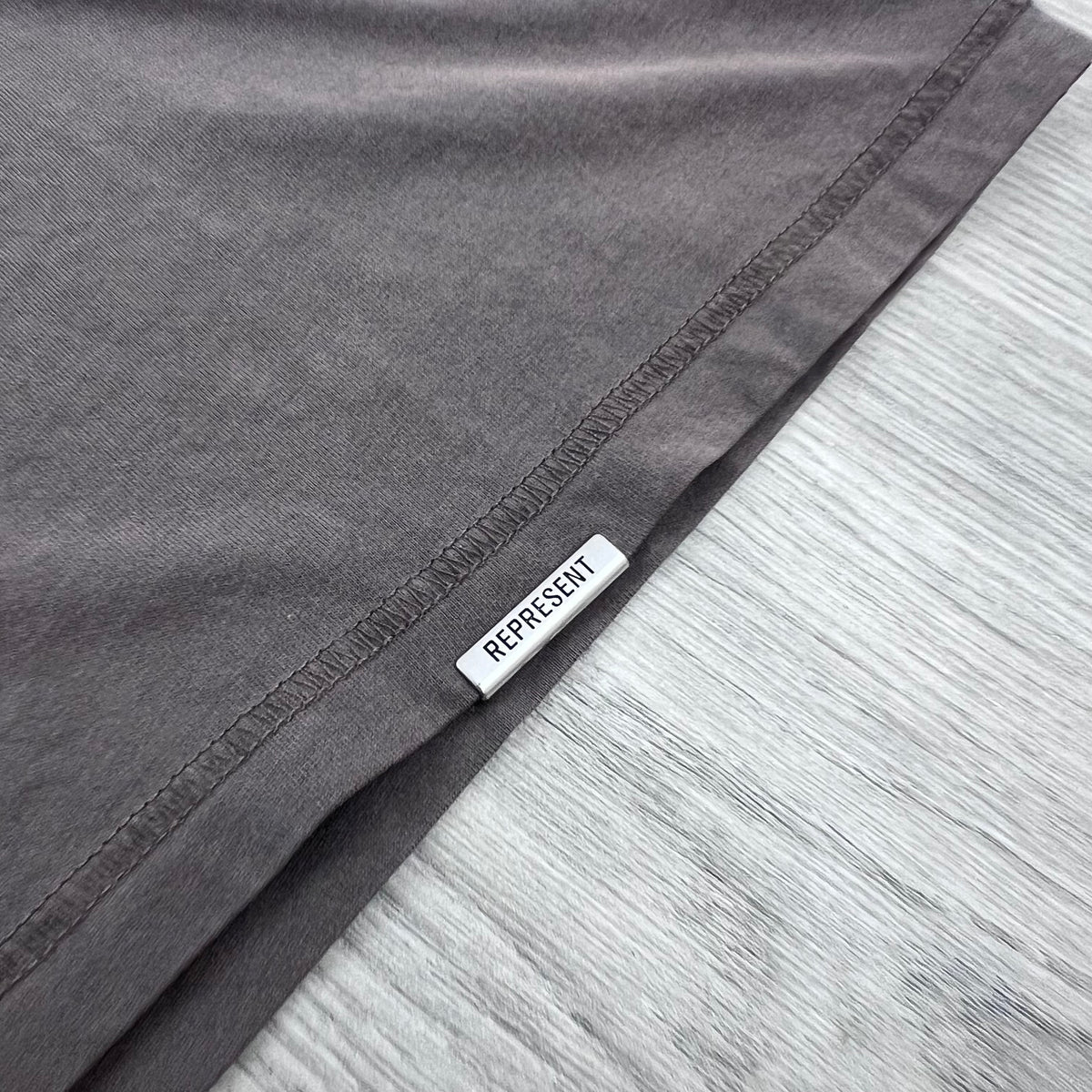 Represent 'Western Initials' T-Shirt in Flat White - Metal hardware detail.