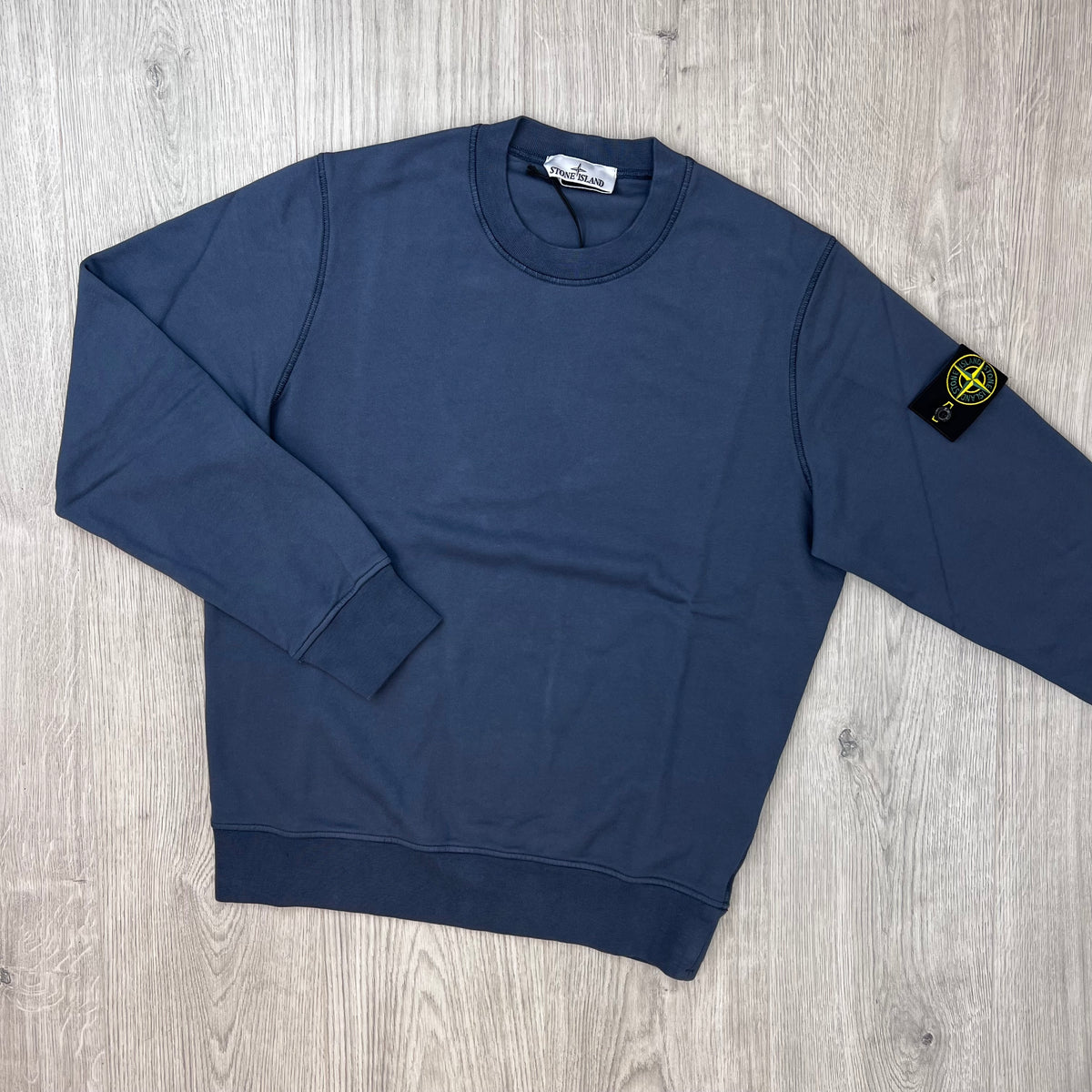 Front view of the Stone Island Crewneck Sweatshirt in Slate Blue.