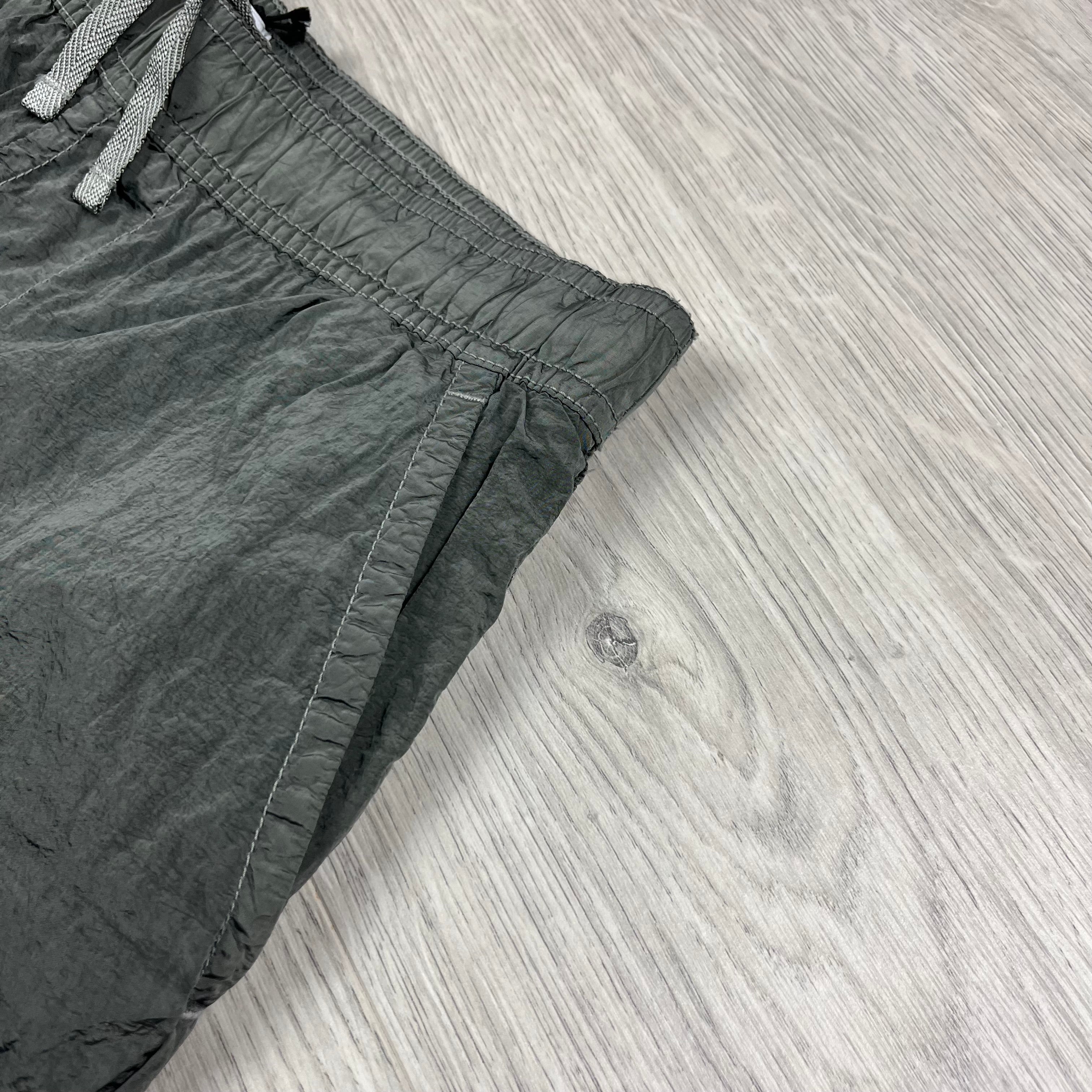 Stone Island Swim Shorts in Military Green. On sale at Open Attire.