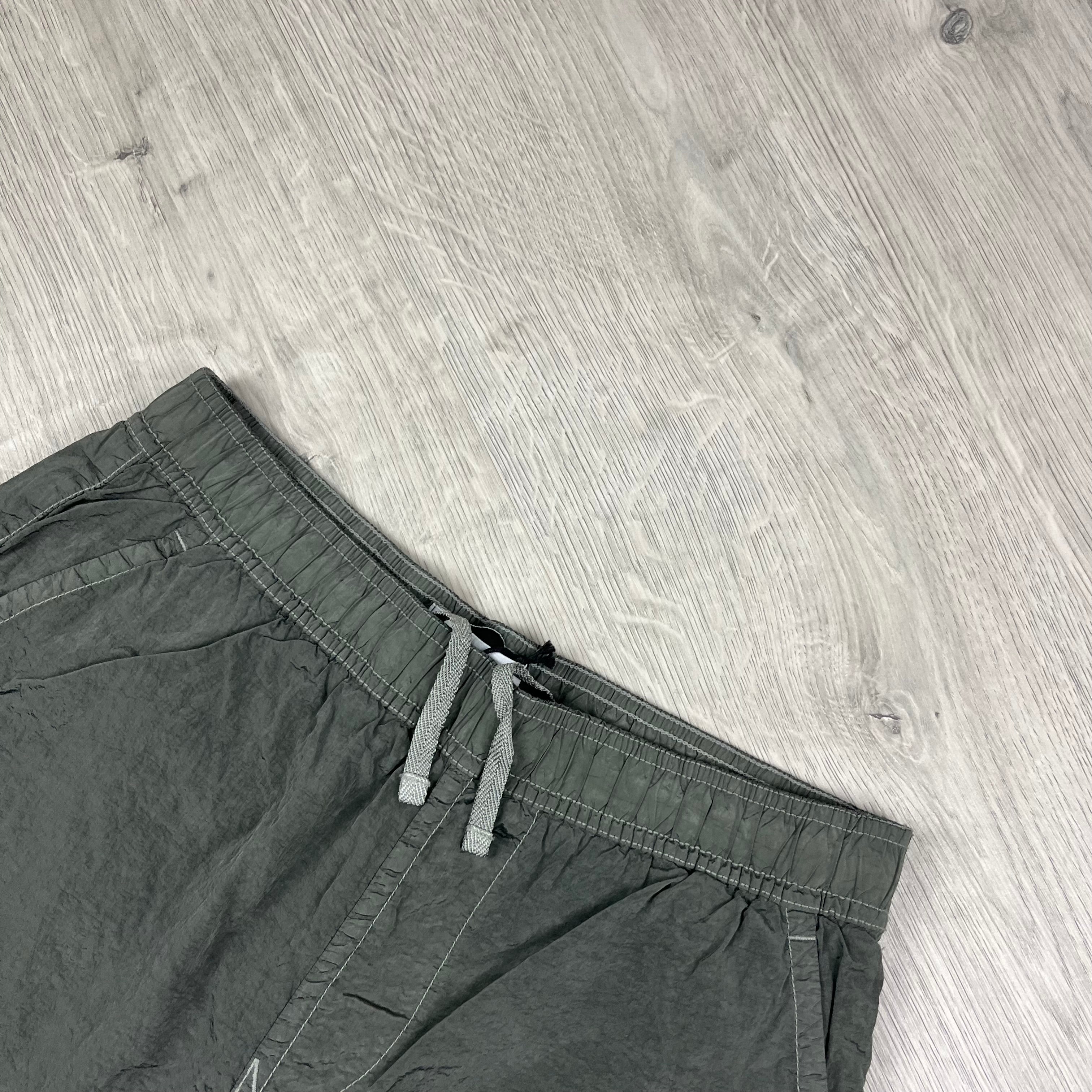 Stone Island Swim Shorts in Military Green. On sale at Open Attire.