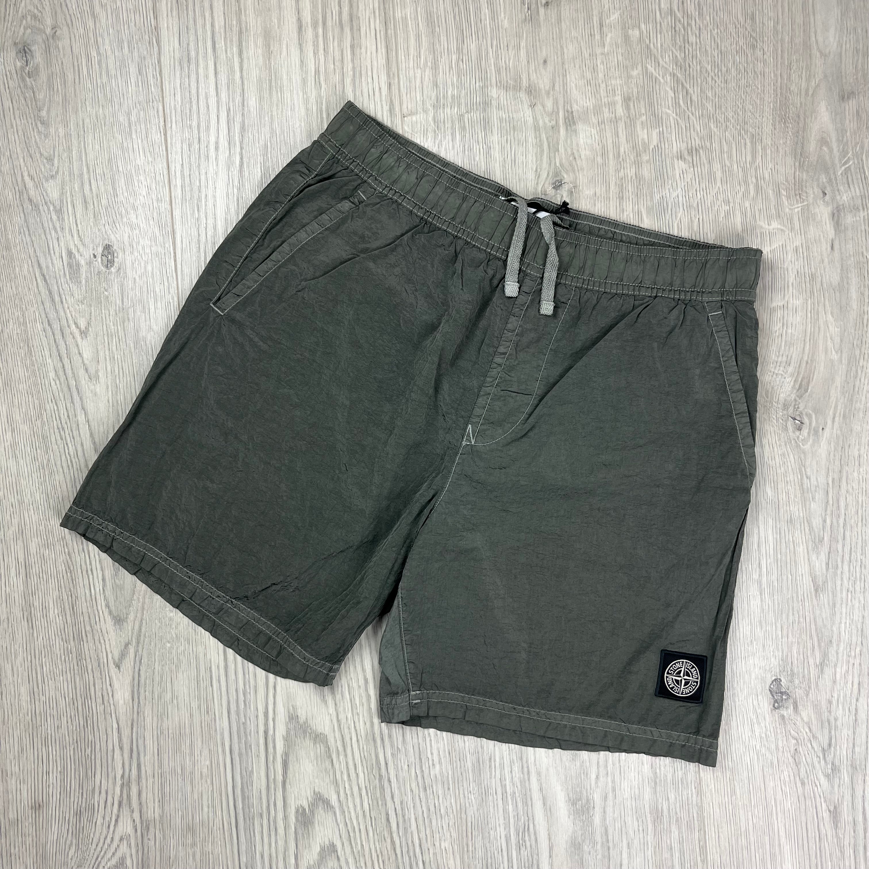 Stone Island Swim Shorts in Military Green. On sale at Open Attire.